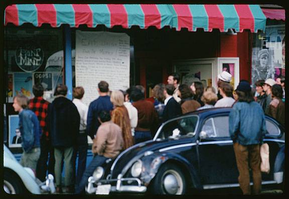 Cushman-march-14-1968-crowd-reads-sign-Eat-Drink-and-Be-Merry-on-Haight-St-P15616.jpg