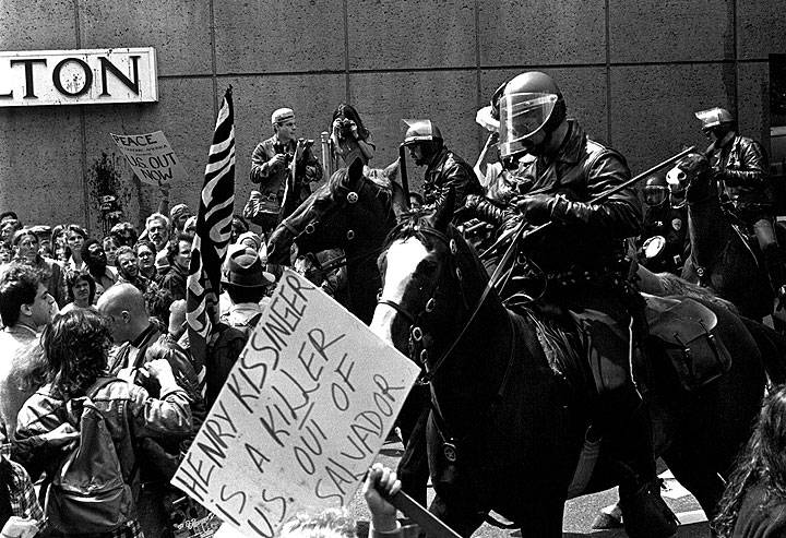 Mounted-police-against-Salvador-demo-w-anti-Kissinger-sign.jpg