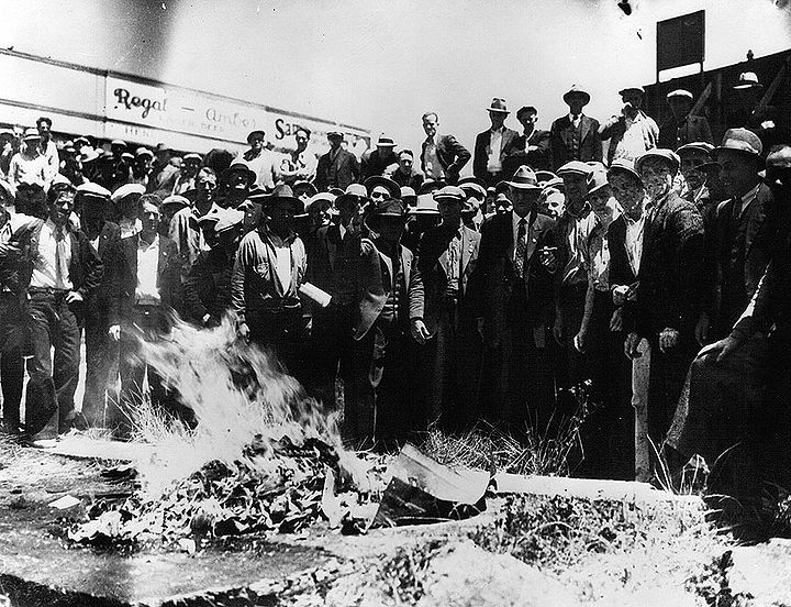 Longshoremen-burn-fink-cards-at-beginning-of-1934-strike bancroft-library.jpg